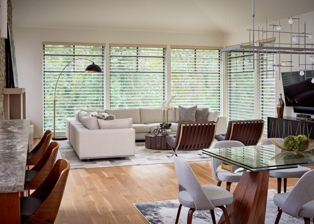 Silhouette sheer shades filtering sunlight while preserving the view through large living room windows