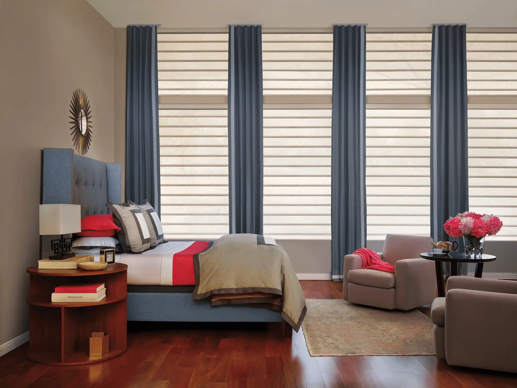 Brightly lit home bedroom with windows decorated with Hunter Douglas Vignette® Modern Roman Shades near Charlotte & Cornelius, North Carolina.