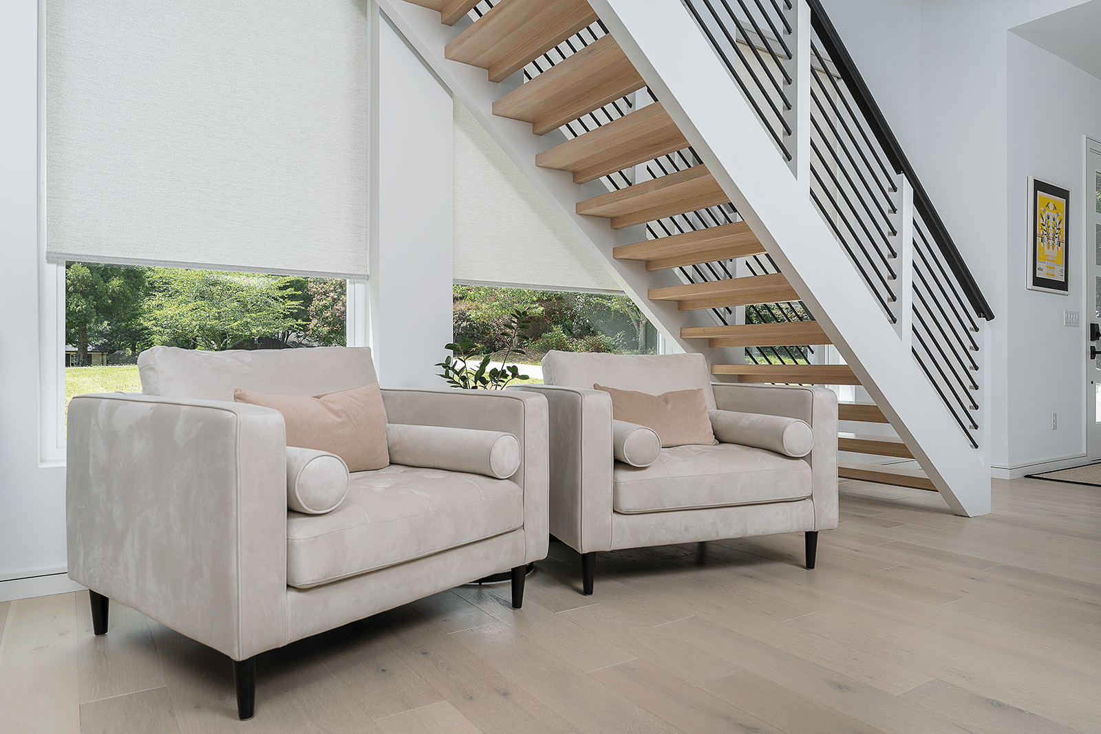 White modern shades in a sitting room next to stairs