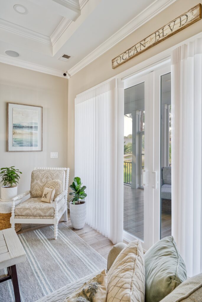 Luminette privacy sheers on sliding glass doors providing soft light and modern vertical coverage