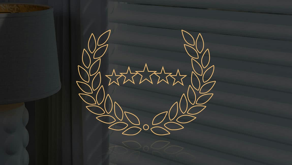 A line-drawn warranty emblem from A Shade Above against the backdrop of a dark shade