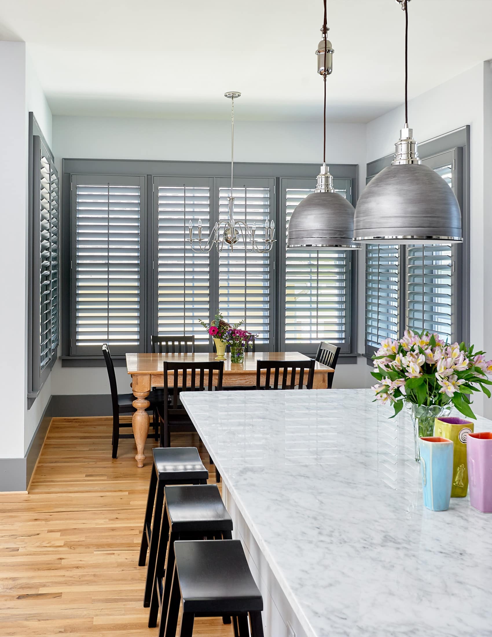 Kitchen space with gray plantation shutters