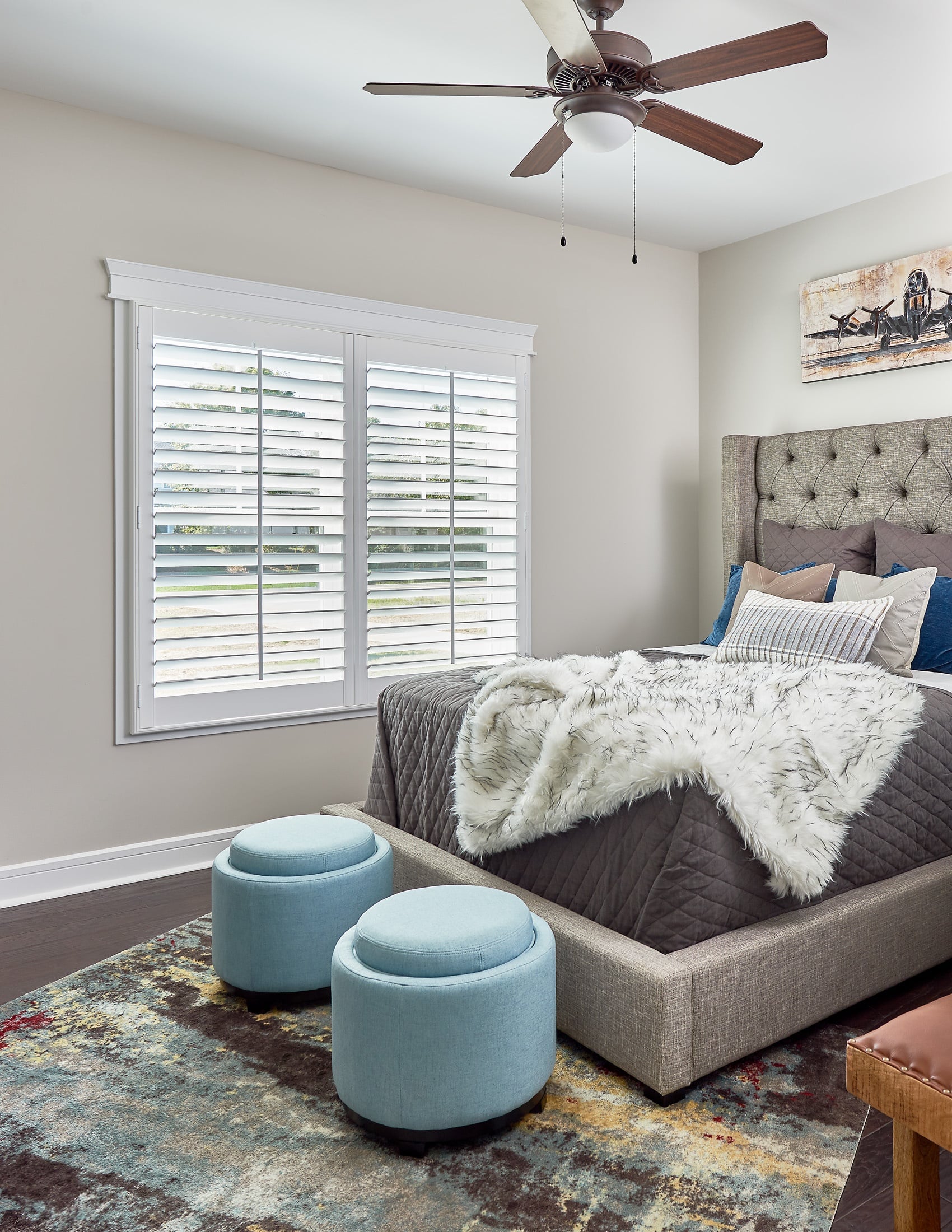 Child's bedroom with white shutters covering the window