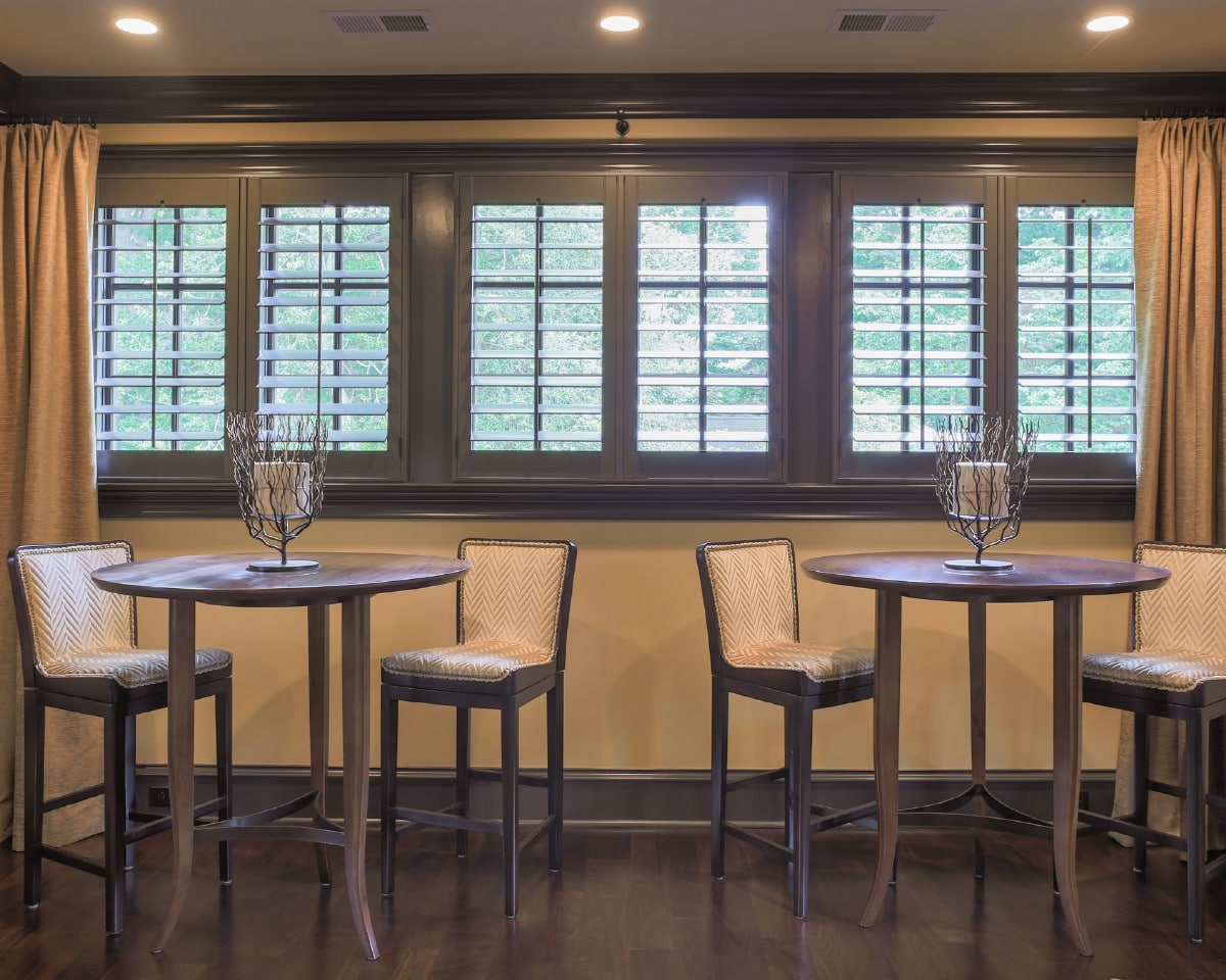 Dark brown shutters in a media room