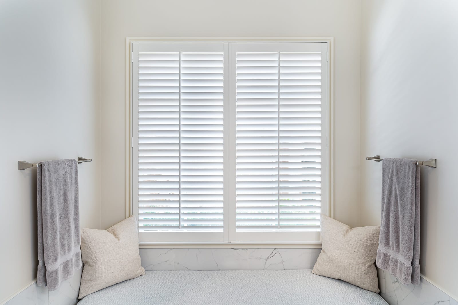 2.5" louver plantation shutters above a bathroom seat