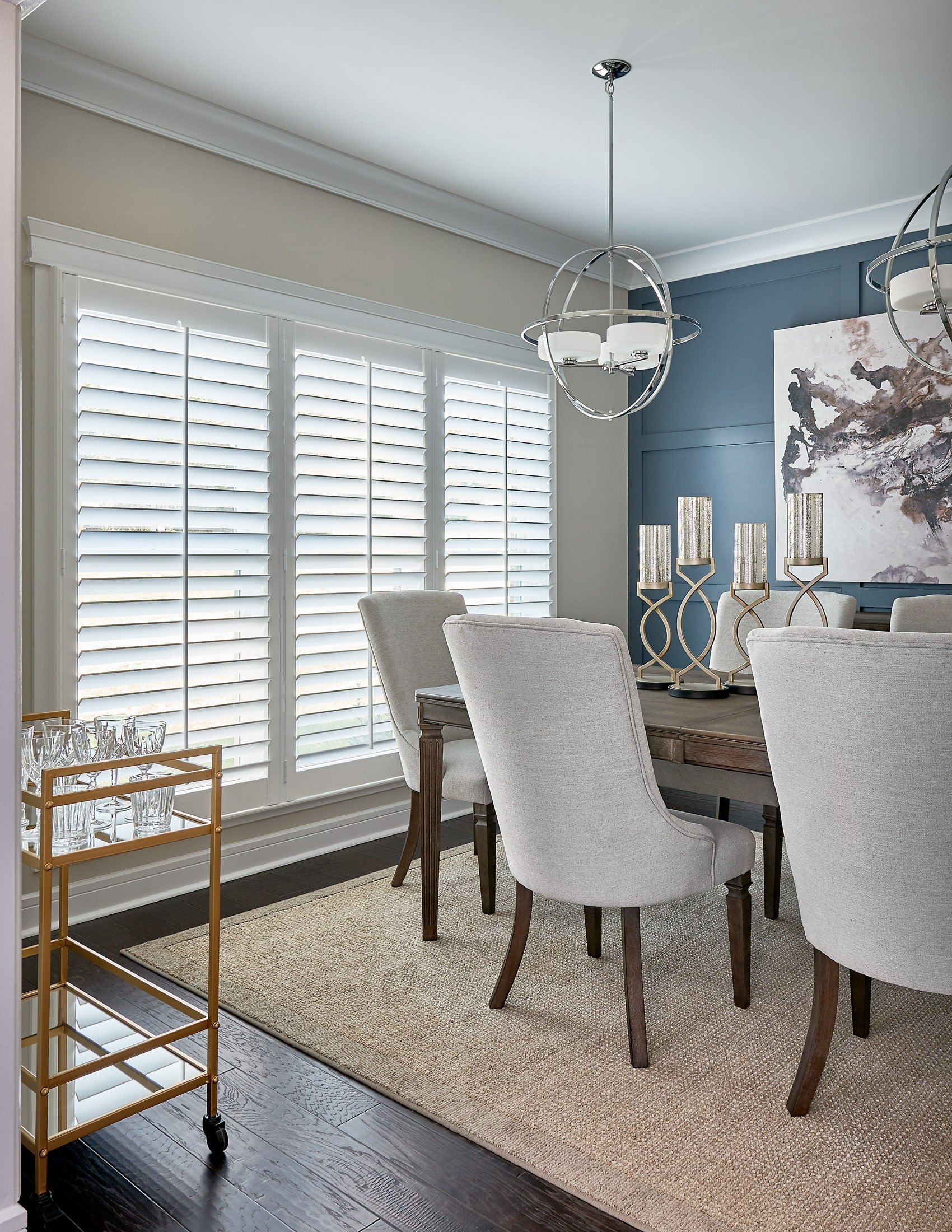 Dining room with a triple white shutter