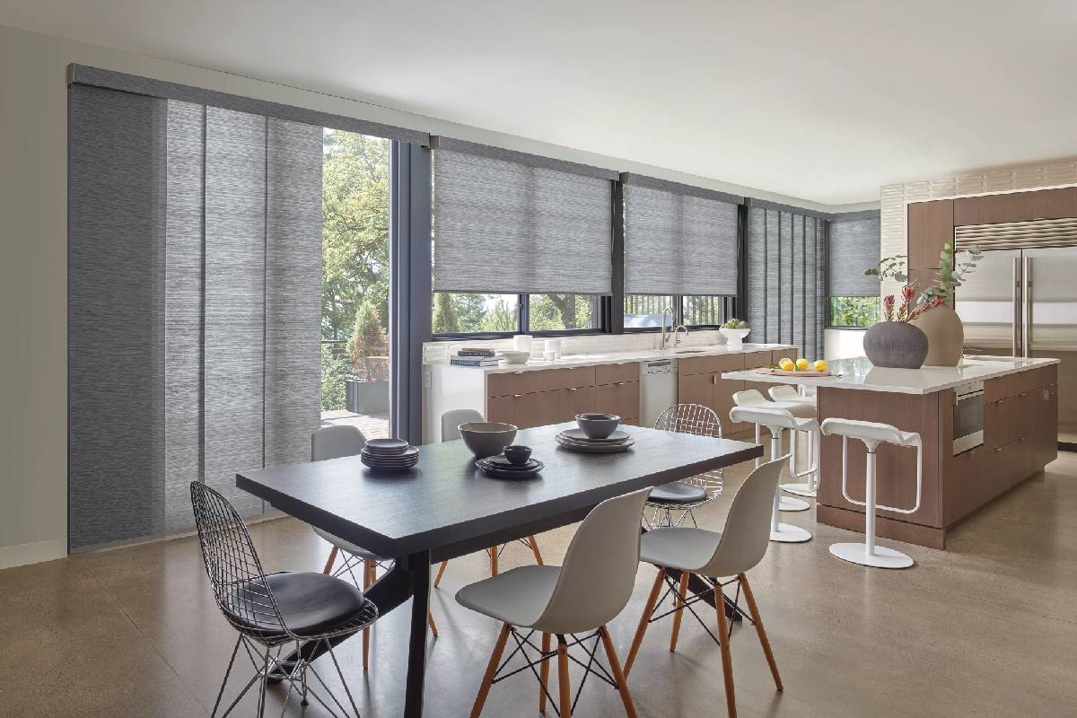 Bright kitchen with large windows outfitted with Hunter Douglas Skyline® Gliding Window Panels