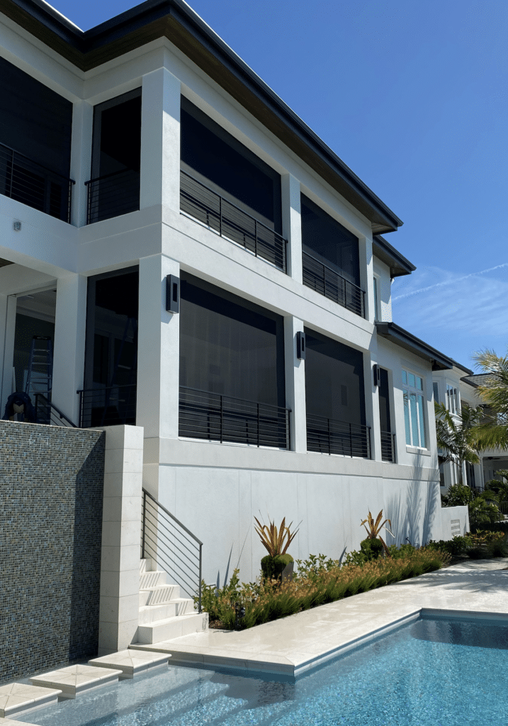 black-exterior-screens-poolside black exterior roller shades reduce heat gain inside the home