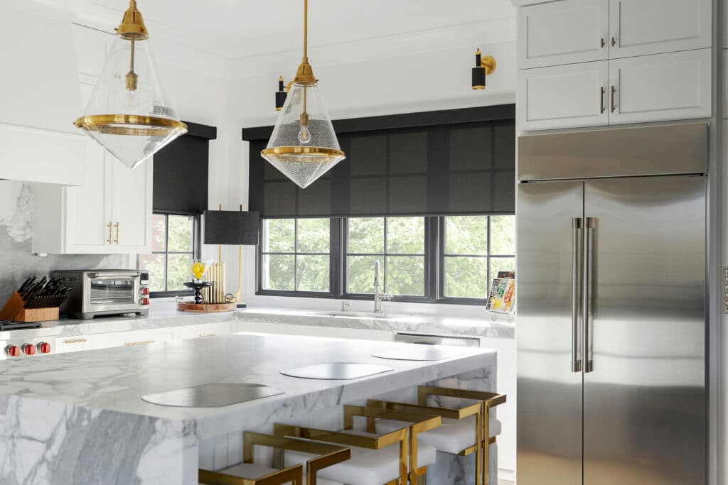 A contemporary kitchen in a Raleigh, North Carolina home featuring sleek black roller shades.