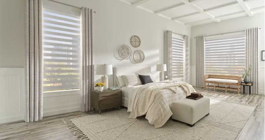 Zebra shades with grommet draperies on bedroom windows for sheer views and room darkening in Charlotte