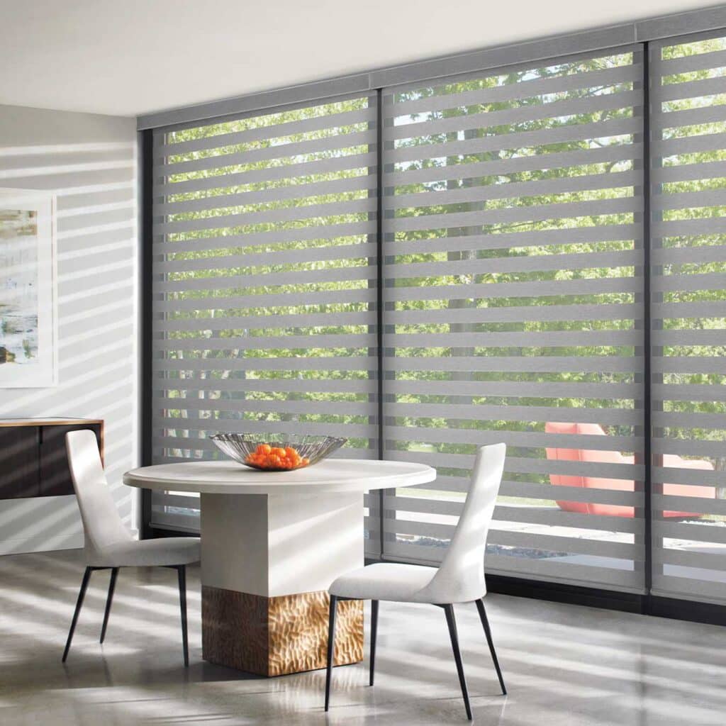 banded shades on floor to ceiling windows for filtered light and reduced glare