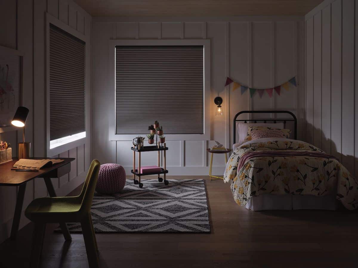 Duette honeycomb blackout shades in a child's bedroom for improved sleep and light control