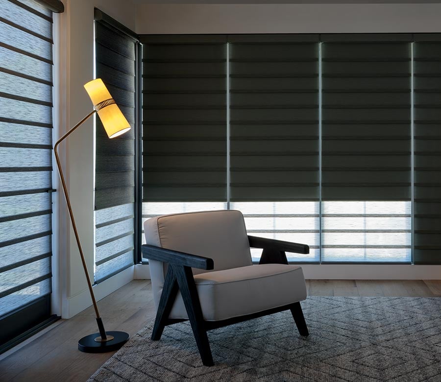 blackout roman shades with dual shade system in bedroom for flexible light control