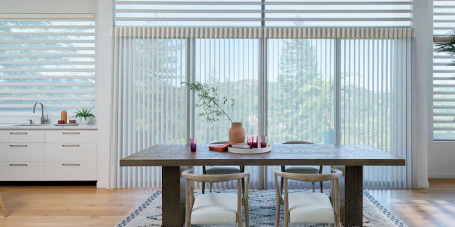 Pirouette shades and Luminette Privacy Sheers coordinating living room windows and glass doors