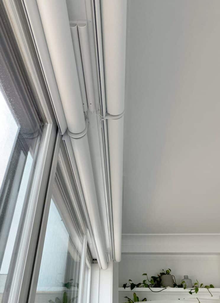 PowerView® rechargeable battery wand mounted behind the shade headrail