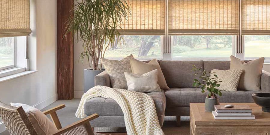 Woven shades styled in a contemporary casual living room
